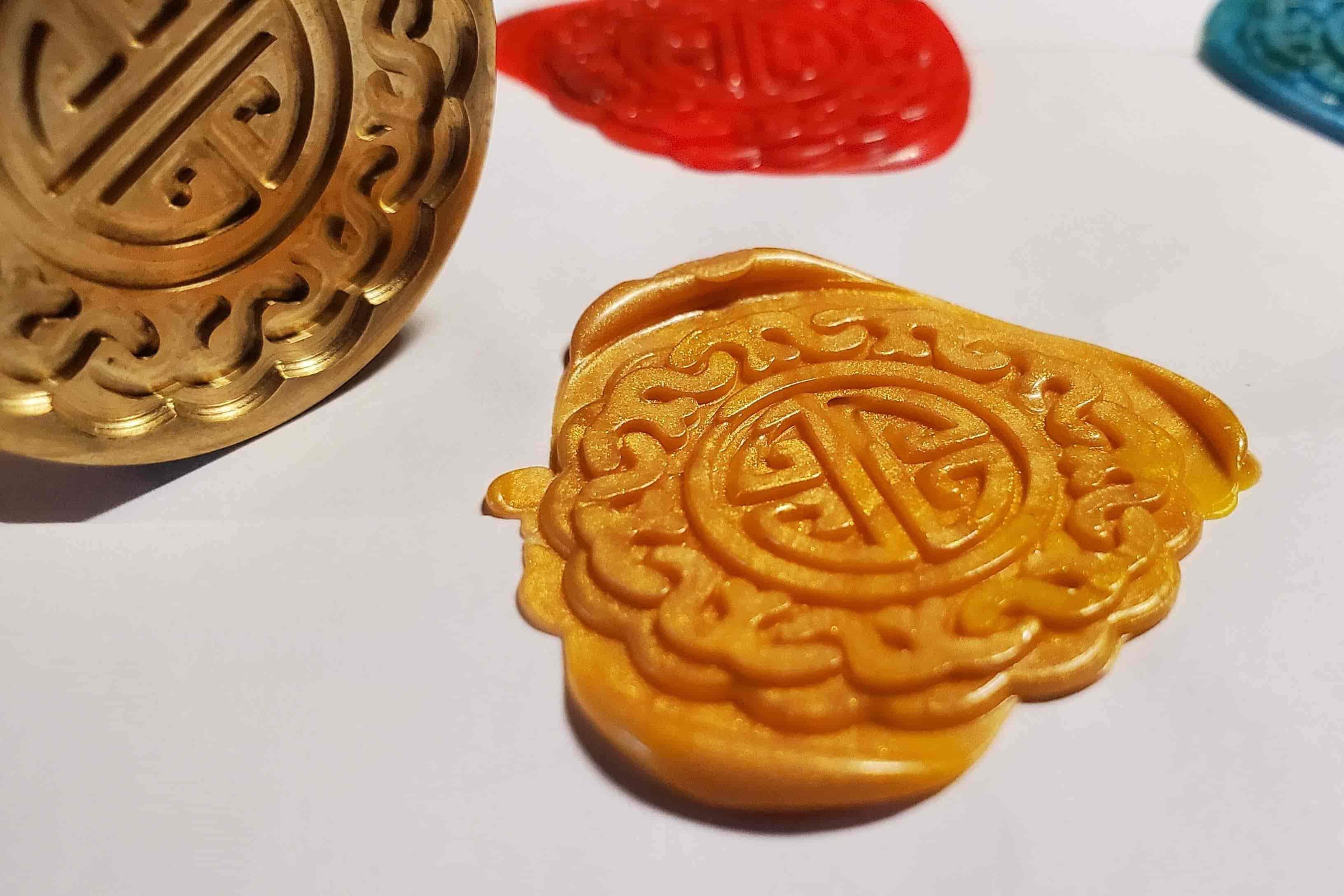 closeup of wax stamped with mooncake pattern